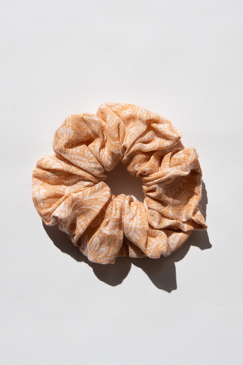 Daughters of India Upcycled Scrunchie in Apricot Blush, a soft peach-orange hair scrunchie made from upcycled cotton fabric