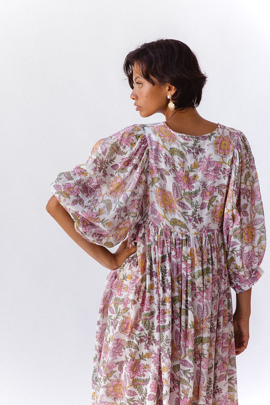 Daughters of India Kyra Midi Dress in Fuchsia Bloom — studio back view, billowed sleeves, gathered waist detail