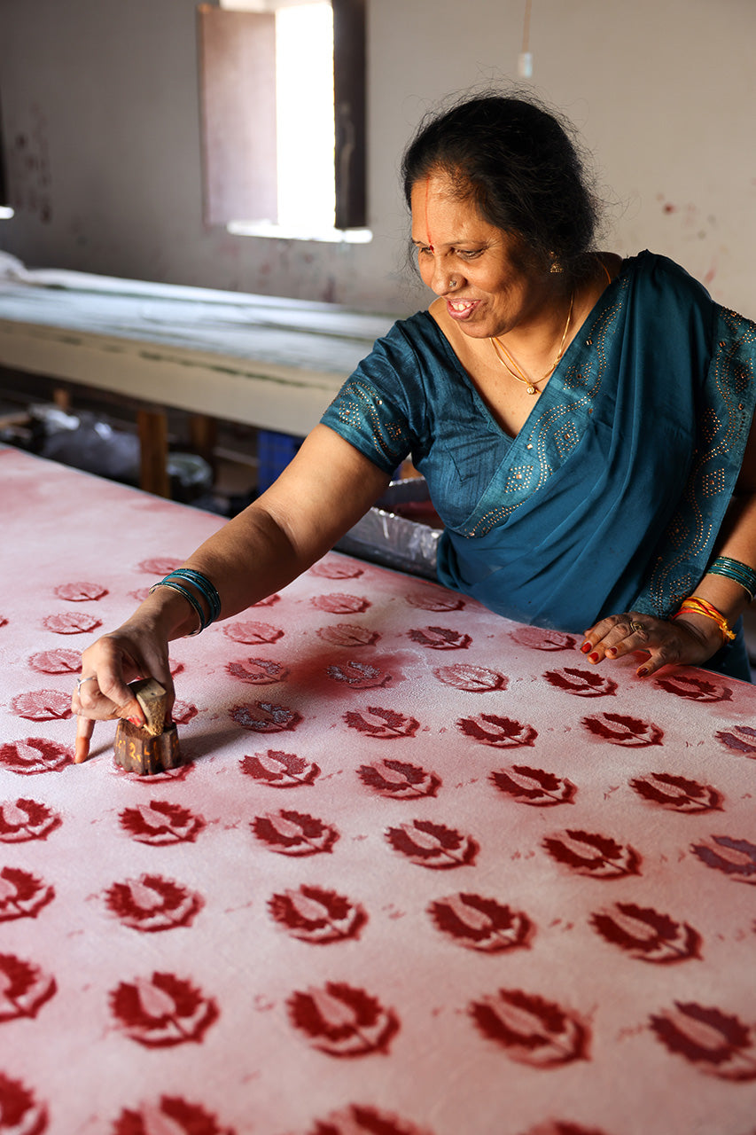 Ria Blouse Ruby Red — artisan block printing process, ruby red botanical leaf motif hand stamped onto cotton fabric, traditional Sanganer Jaipur block printing technique India | Daughters of India