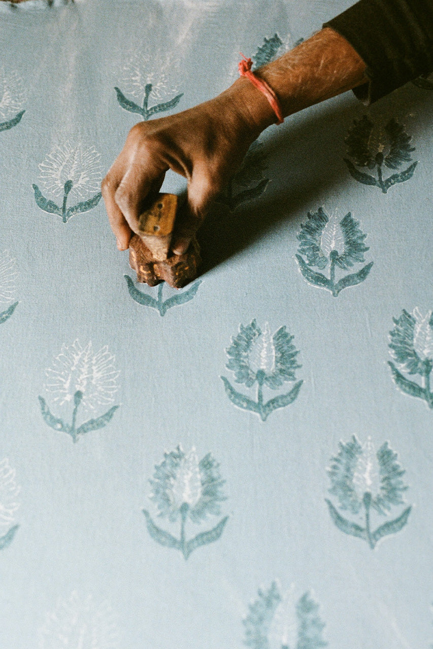 Ria Blouse Sky — fabric close-up, hand block print floral pattern on sky blue cotton, Sanganer Jaipur artisan textile craft | Daughters of India