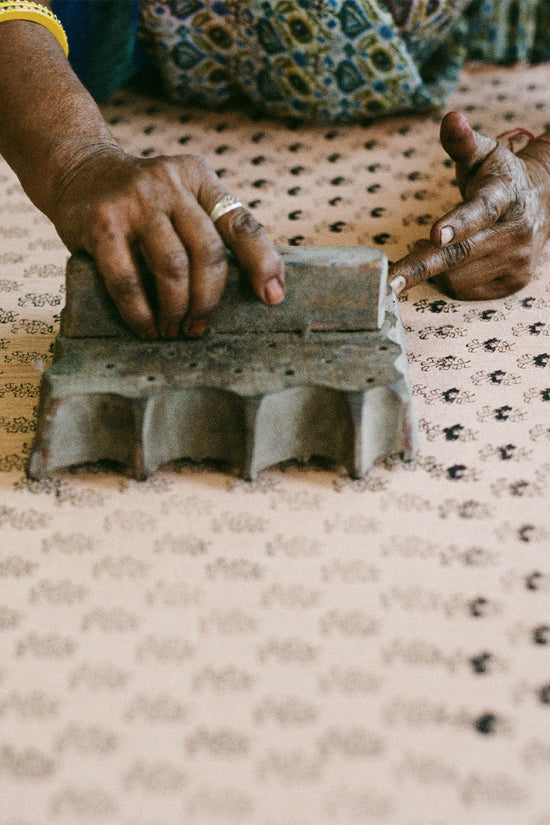 Sundress Mini Peach — artisan workshop Jaipur, craftsperson hand printing natural cotton fabric using traditional block printing technique, ethical slow fashion India | Daughters of India