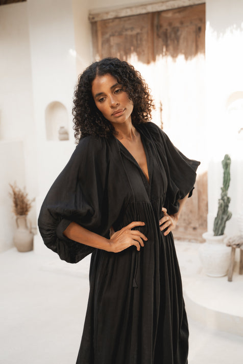Daughters of India Kyra Midi Dress in Black Gauze — close-up V-neckline and billowed sleeves, gathered waist, cotton gauze